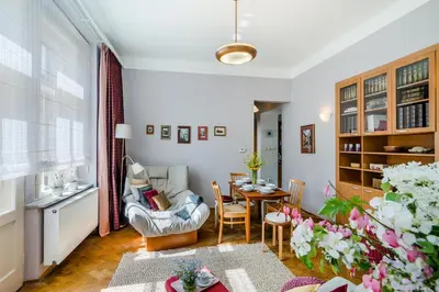 a living room with a table and a chair at APT near OLD TOWN Prague by Michal&Friends in Prague