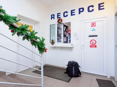 a backpack sitting on the floor in front of a door at Hostel BOHEMIA in Prague