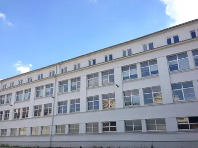 a large white building with many windows at Hostel BOHEMIA in Prague
