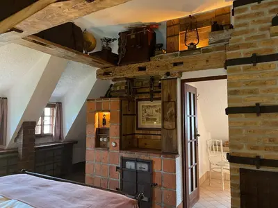 a wooden swing hanging from the ceiling in a room at Romantik Hotel U Raka in Prague