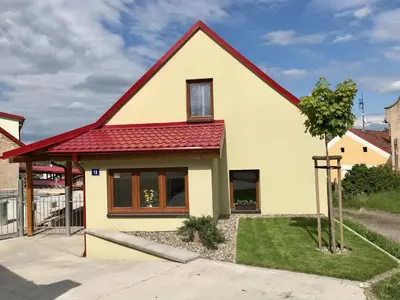 a house with a red roof at Bendovský dvůr in Dušníky