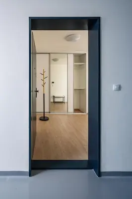 a view of a room through a glass door at Prague Days - Apartment with Balcony and Parking in Trendy New Residential Area in Karlín in Prague
