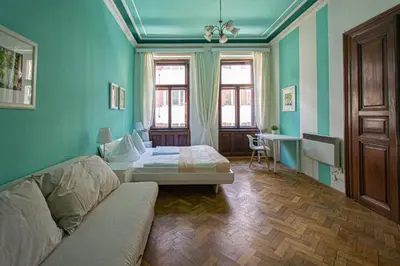 a room with a couch and a bed in it at For celebrations spacious 3BDR apartment with balcony in Prague