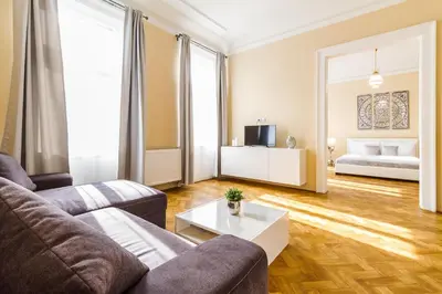 a living room with a couch and a table at Lovely 2BDs apartment near Petřín Tower - P14 in Prague