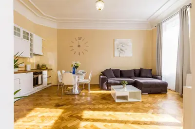 a living room with a couch and a table at Lovely 2BDs apartment near Petřín Tower - P14 in Prague