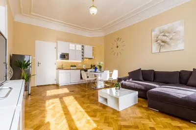 a living room with a couch and a table at Lovely 2BDs apartment near Petřín Tower - P14 in Prague