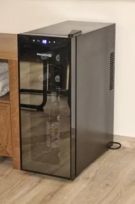 a microwave oven sitting on top of a wooden floor at Pension Kotva in Beroun