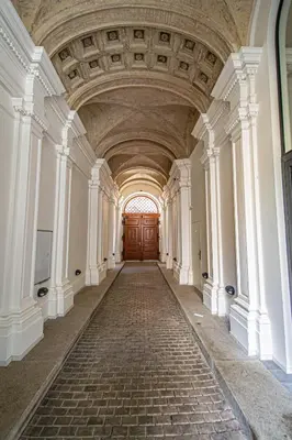 an empty hallway in a building with a wooden door at Main train station apartment close to the the Main Square! in Prague