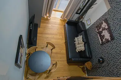an overhead view of a living room with a table and chairs at Main train station apartment close to the the Main Square! in Prague