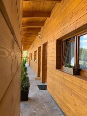 a hallway of a house with wooden walls and windows at Vyhlídka Slapy Nová Živohošť in Křečovice