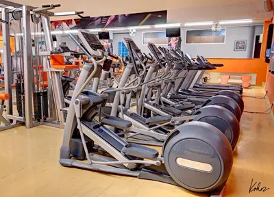 a row of treadmills in a gym at AXA Hotel in Prague