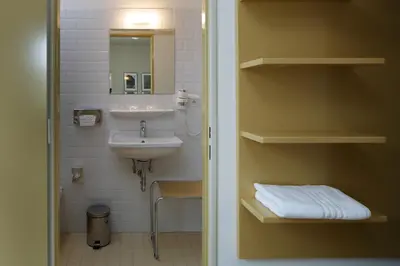a bathroom with a sink and a mirror at AXA Hotel in Prague