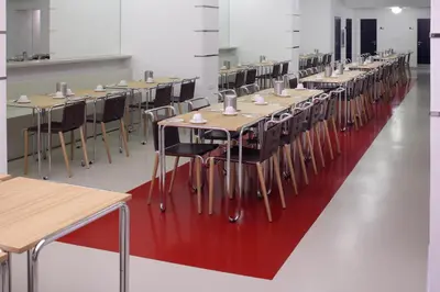 a row of tables and chairs in a room at AXA Hotel in Prague