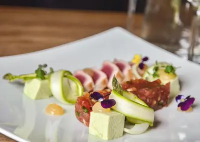 a white plate of food on a table at Resort Čapí Hnízdo in Olbramovice Ves