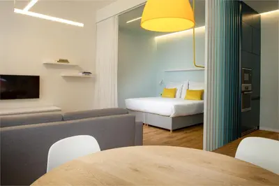 a living room with a couch and a table at OREA Place Seno in Prague