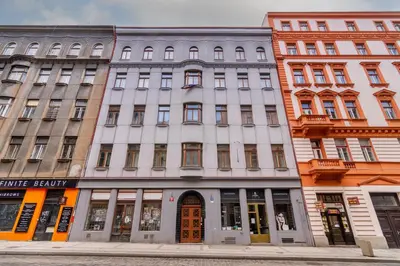 a glass elevator with a mirror on the wall at Prague Days - Premium Loft with AC & View of the Žižkov Tower from Spacious Terrace in Prague