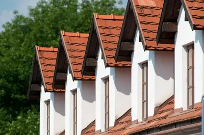 a row of roofs on a building at Babiččina Zahrada Penzion & Restaurant in Pruhonice