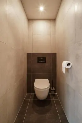 a bathroom with a white toilet in a room at Gesto Apartments in Prague