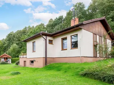 a house in the middle of a grass field at Holiday Home Měřín by Interhome in Rabyně