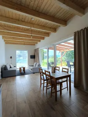 a living room with a table and chairs at Panorama house Brdy in Příbram