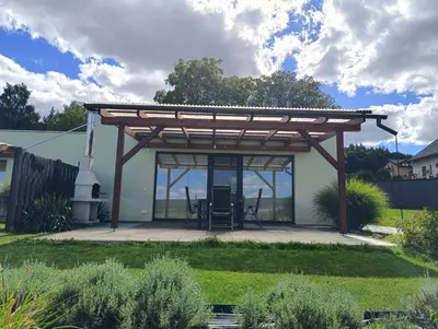 a pergola on a patio in a yard at Panorama house Brdy in Příbram