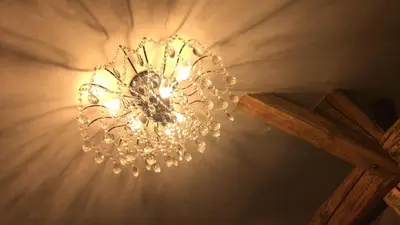 a chandelier hanging from a ceiling in a room at Apartman Romantica in Poděbrady