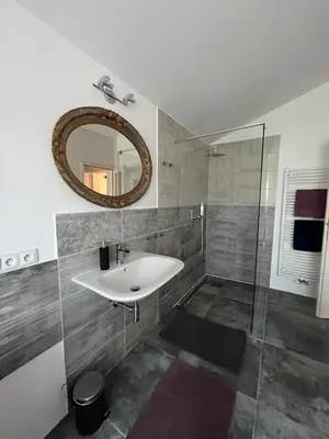 a bathroom with a sink and a mirror at Apartman Romantica in Poděbrady
