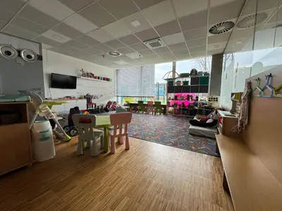 a room with a classroom with a table and chairs at Blue Orange Resort in Prague