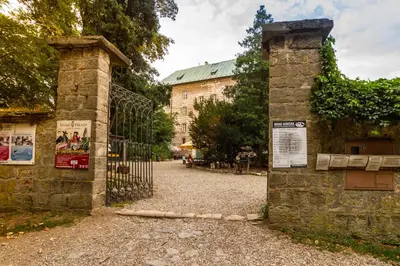 an entrance to a gate to a building at Hájovna hradu Houska in Doksy