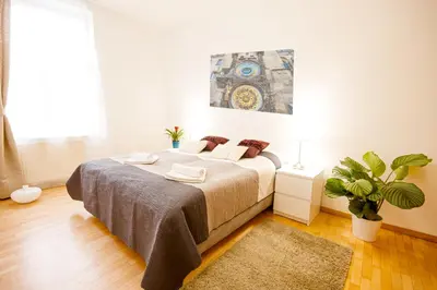 a bedroom with a large bed in a room at Wenceslas Square Lofts in Prague