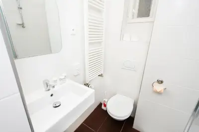 a bathroom with a toilet and a sink at Fashion Loft in Prague