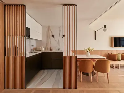 a kitchen and dining room with a table and chairs at The Julius Prague in Prague