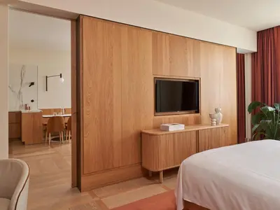 a hotel room with a bed and a flat screen tv at The Julius Prague in Prague