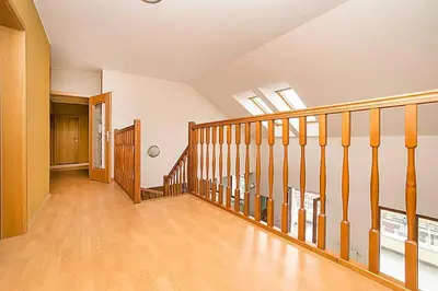 an empty hallway with a staircase in a house at Great Terrace in Big, Central Flat in Prague