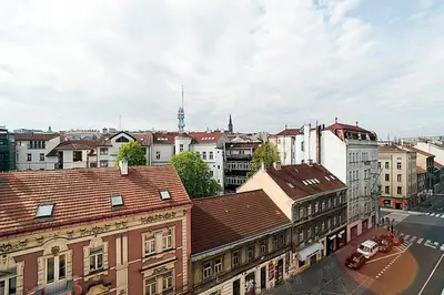 an overhead view of a city with buildings and a street at Great Terrace in Big, Central Flat in Prague