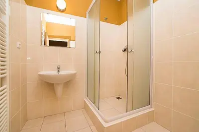 a bathroom with a shower and a sink at Great Terrace in Big, Central Flat in Prague