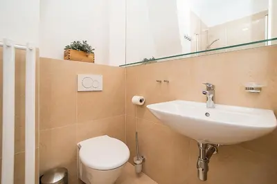 a bathroom with a sink and a toilet at Newly renovated 1-bed apartment at Charles Bridge in Prague