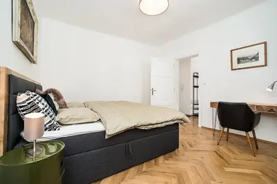 a bedroom with a bed and a desk in it at Newly renovated 1-bed apartment at Charles Bridge in Prague