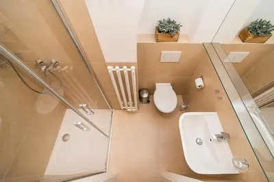 a bathroom with a shower and a toilet and a sink at Newly renovated 1-bed apartment at Charles Bridge in Prague
