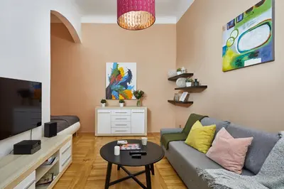 a living room with a couch and a table at Prague Days - Studio in the Heart of Prague near Astronomical Clock in Prague