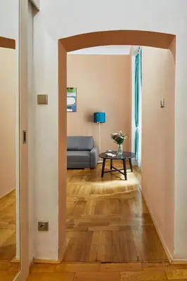a living room with a couch and a table at Prague Days - Studio in the Heart of Prague near Astronomical Clock in Prague