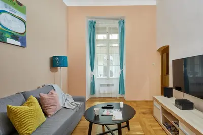 a living room with a couch and a table at Prague Days - Studio in the Heart of Prague near Astronomical Clock in Prague