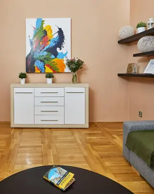a living room with a tv on top of a dresser at Prague Days - Studio in the Heart of Prague near Astronomical Clock in Prague
