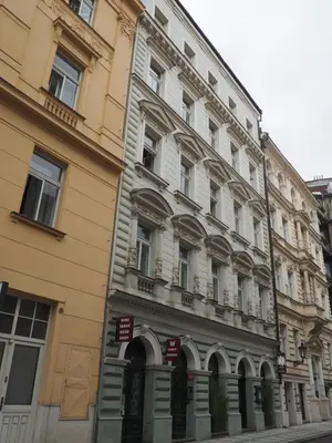 a large building on the side of a street at Stylový byt v srdci Prahy in Prague