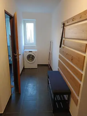a laundry room with a washer and a washing machine at Apartmán Matěj in Poděbrady