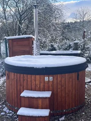 a hot tub with snow on top of it at Vilka Petra pod Bezdězem in Weisswasser in Böhmen