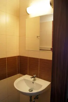 a bathroom with a sink and a mirror at Penzion Ranch in Hořovice