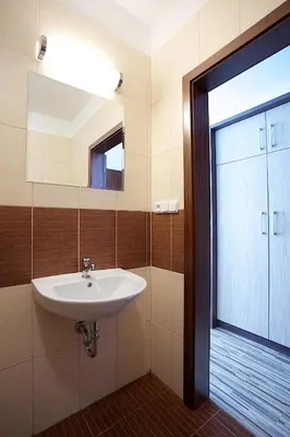 a bathroom with a sink and a mirror and a window at Penzion Ranch in Hořovice