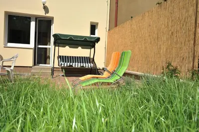 two chairs and a table in a yard at Habitat 16 in Prague