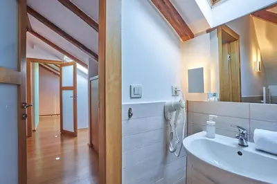 a bathroom with a sink and a mirror at Žatecká - Terrace Residence in the Old Town in Prague